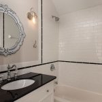 Black and white tile hall bath